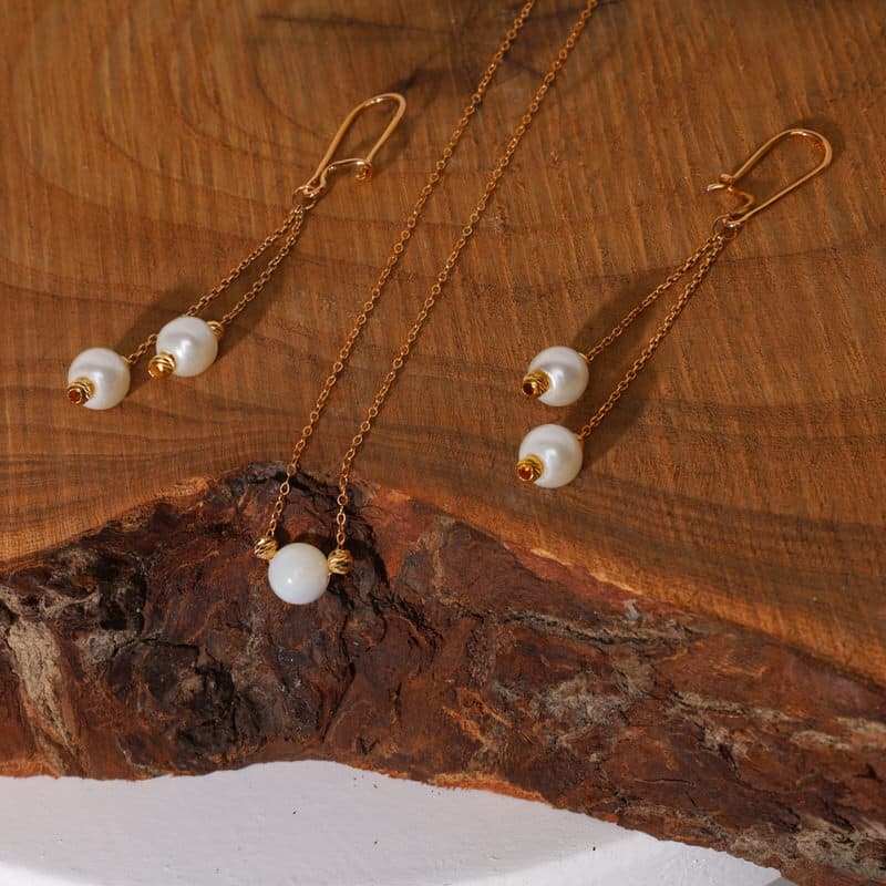 گوشواره عصایی طلا 18 عیار طرح البرنادو و شل - تصویر 1